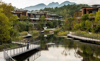 Residential complex built around a body of water with overhanging walkways