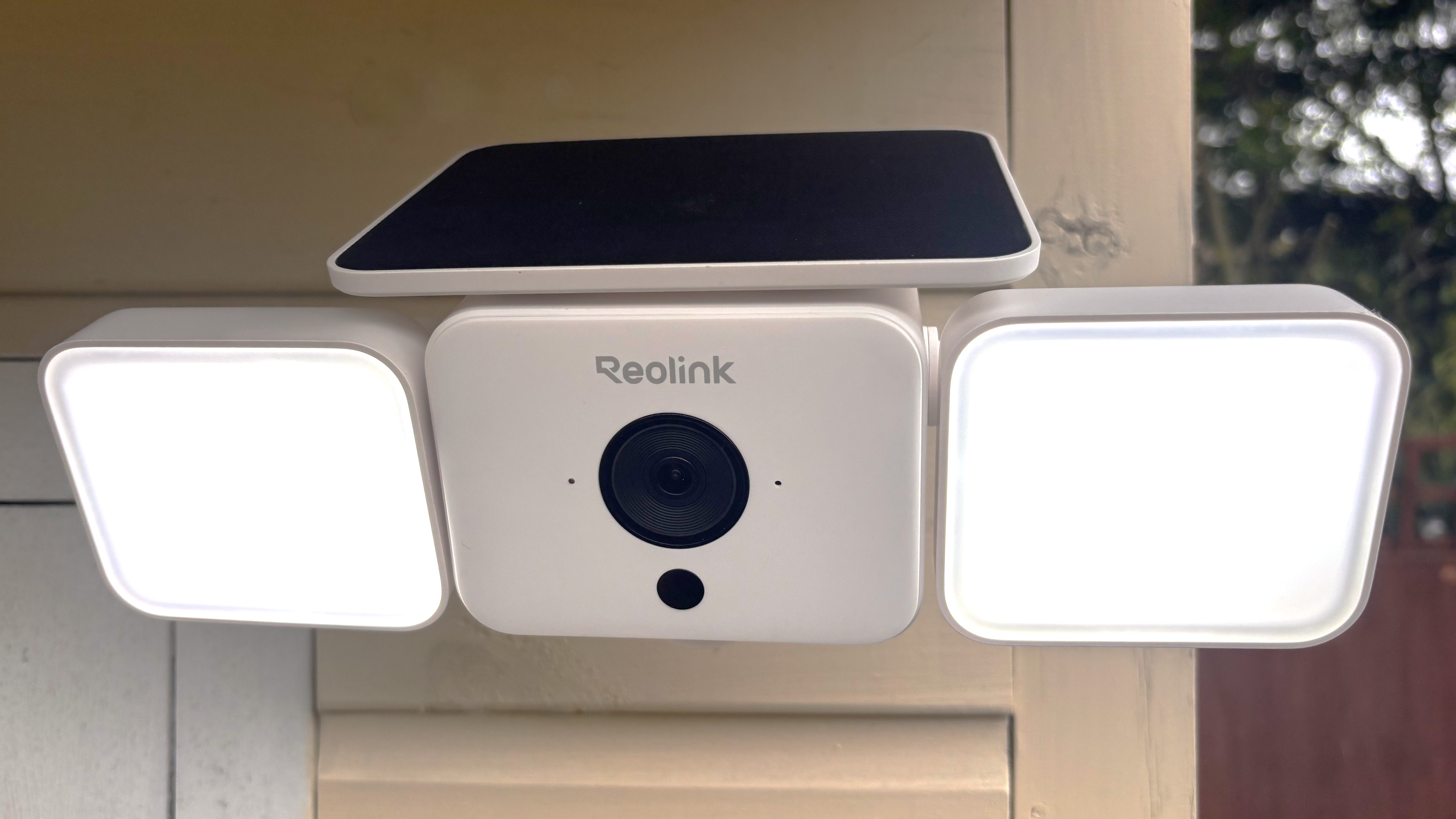 Reolink Solar Floodlight Cam mounted on wall