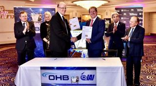 Marco Fuchs of OHB shakes hands with Opher Doron of IAI after signing a teaming agreement for commercial lunar lander services Jan. 29.