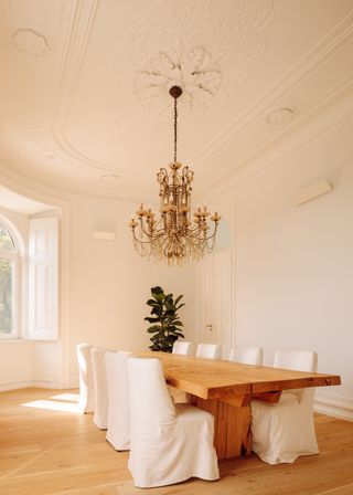 A dining room with an intricate crown molding