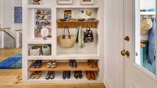 An entryway with shoes organized neatly