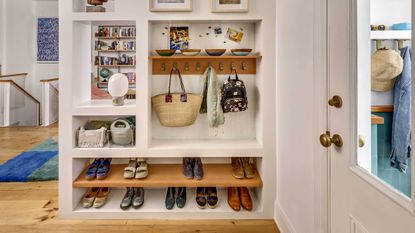 An entryway with shoes organized neatly