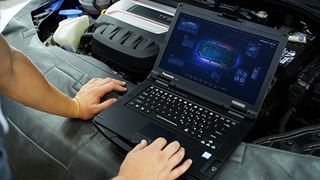 A mechanic uses the Panasonic Toughbook 55, one of the best rugged laptops