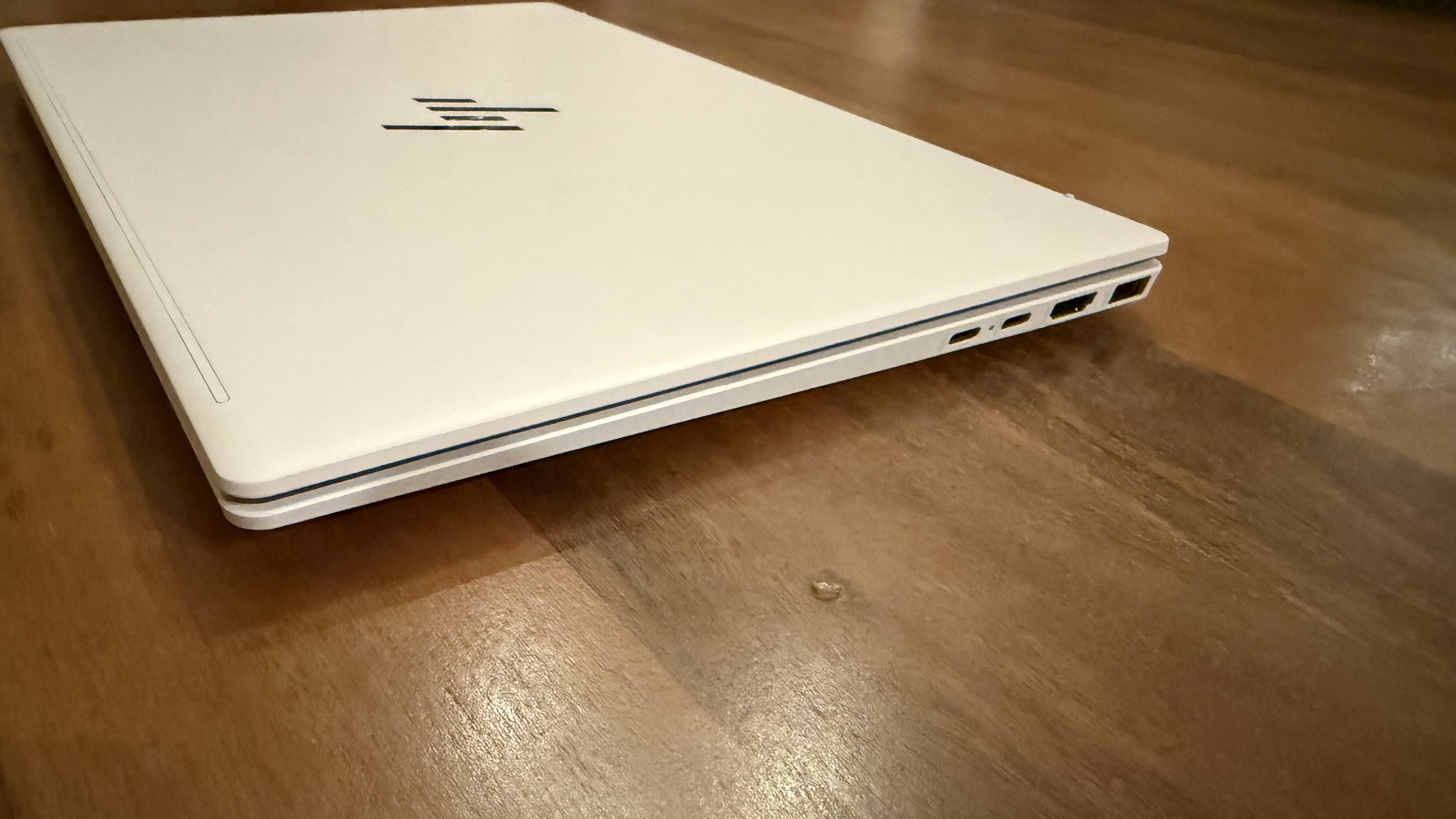 HP OmniBook 7 Aero laptop on a wooden desk