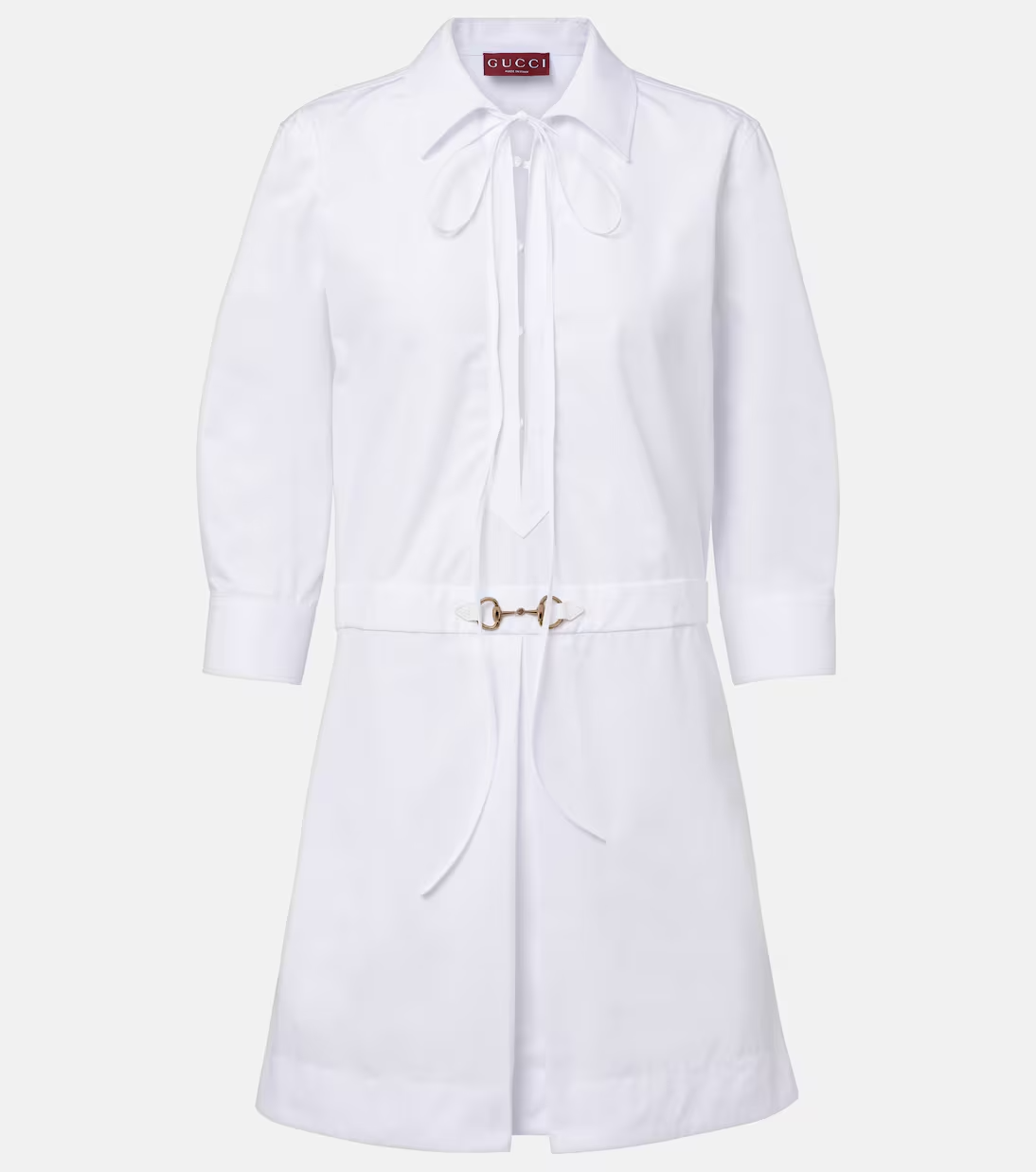 A white Gucci dress with a horse bit belt