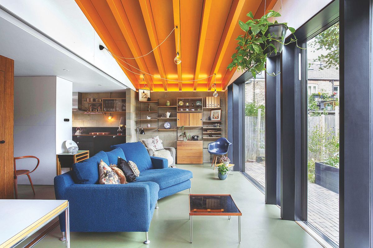 modern living room with large sliding doors and exposed materials