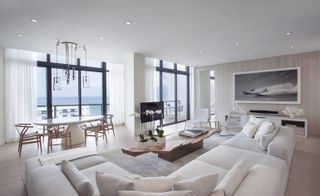 The luxe-beach vibe with white washed driftwood panels, leather, and sand-toned mats,