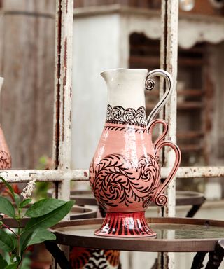 Pink and white decorative vase by Katrin Moye at Petersham Nurseries