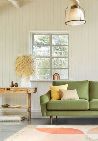 green The Rebel Snug sofa and beach style rattan lamp