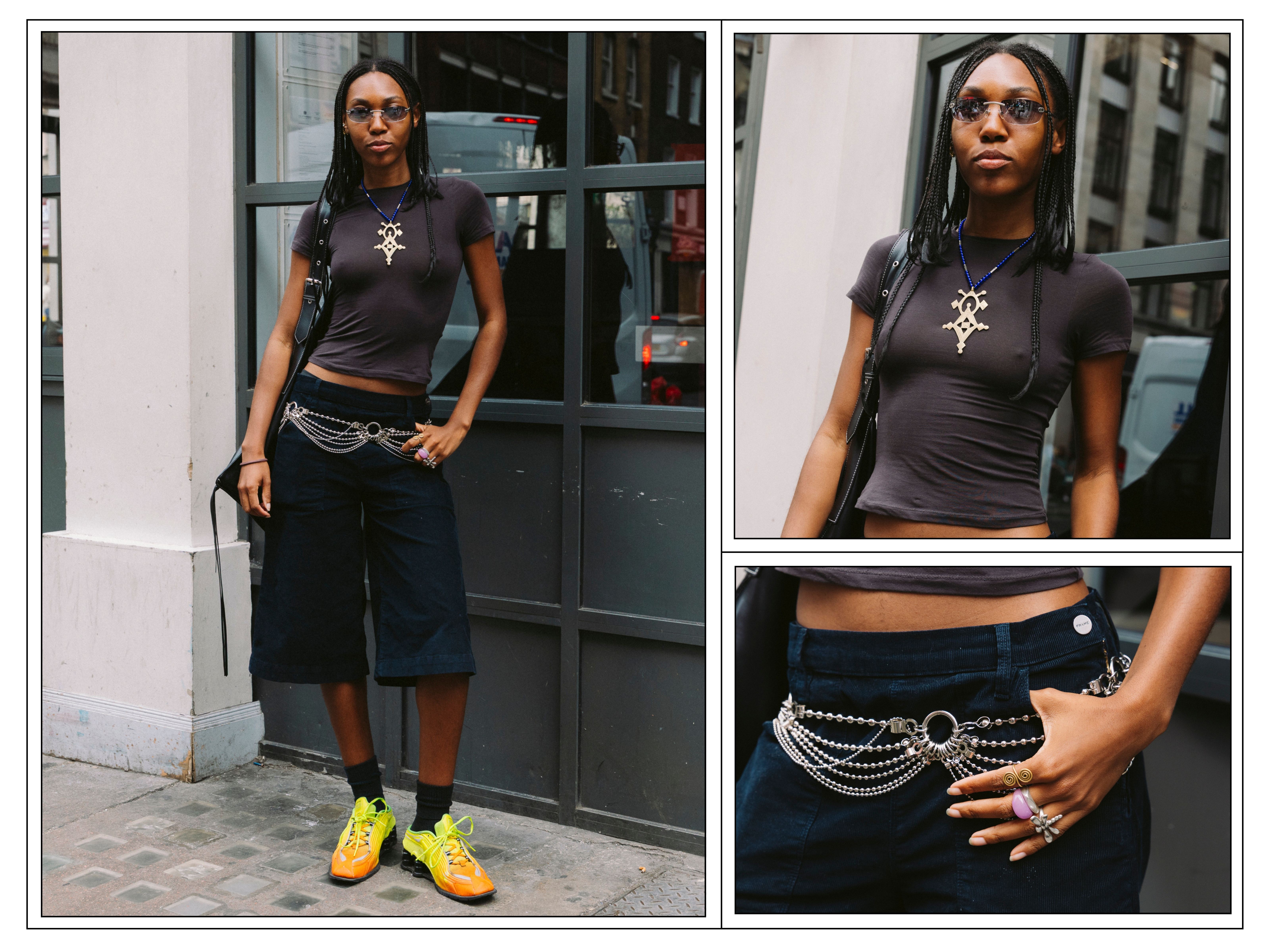 A woman wears yellow trainers and dark blue Bermuda shorts in London