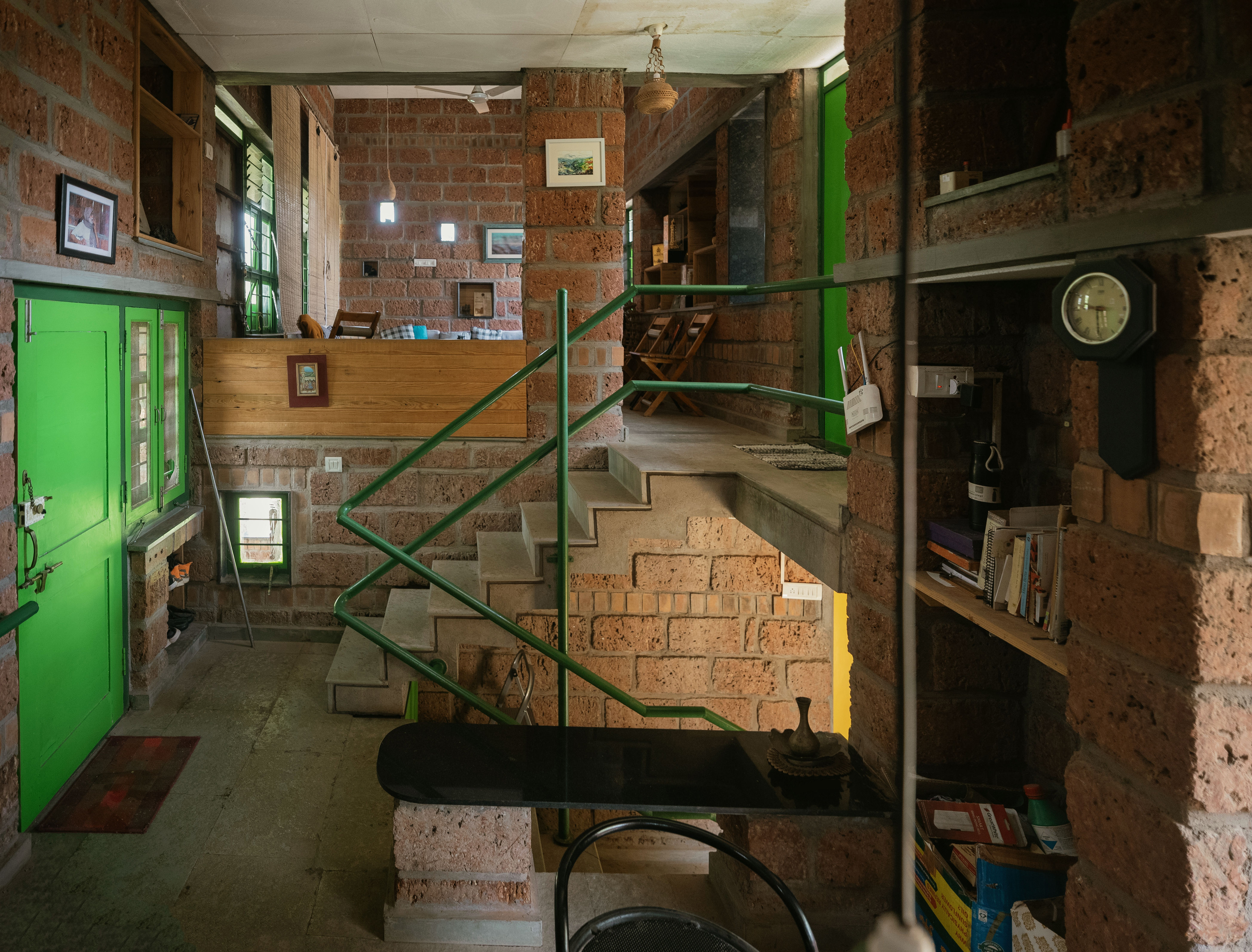 Kanade brothers house in India, brick structure in green surrounds