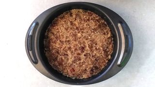 Ground nuts and chopped dates pressed into loose-bottomed cake tin