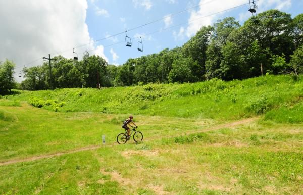 Katie Compton (Planet Bike) all alone as she traverses the ski slope.