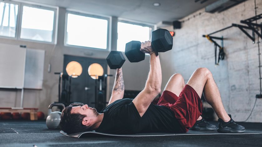 Man performing a dumbbell chest press