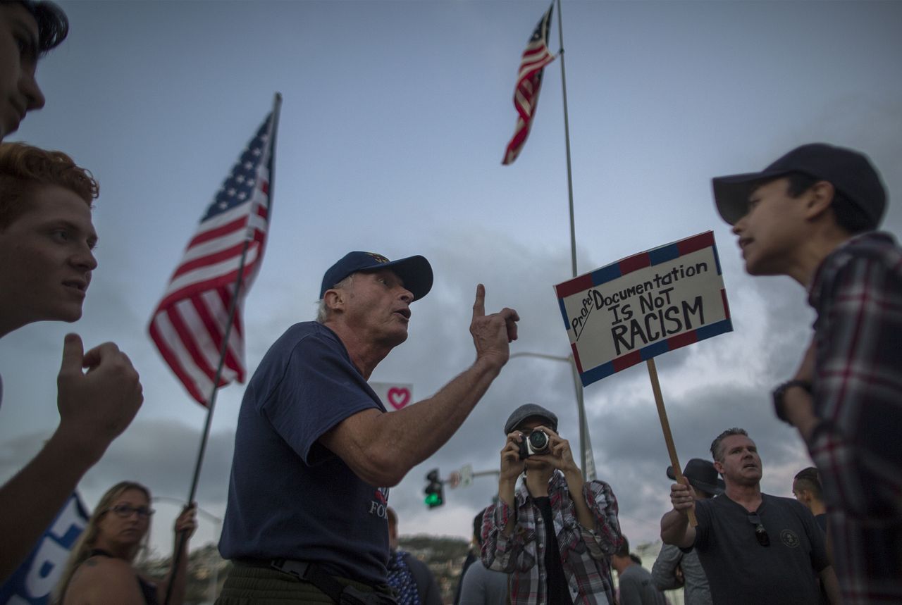 Pro-immigrant demonstrators and anti-immigration demonstrators clash.