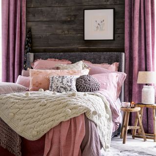 Cosy bedroom with layered linens, blankets and pillows