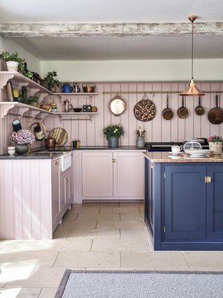 Pink country kitchen with navy blue island
