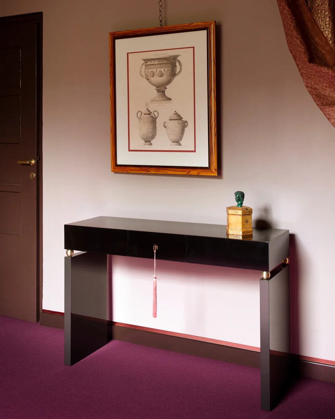 Lacquer console table with slender passementerie key tassel