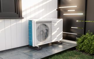 visual of air source heat pump on path at side of house with white cladding and dark grey windows and gate