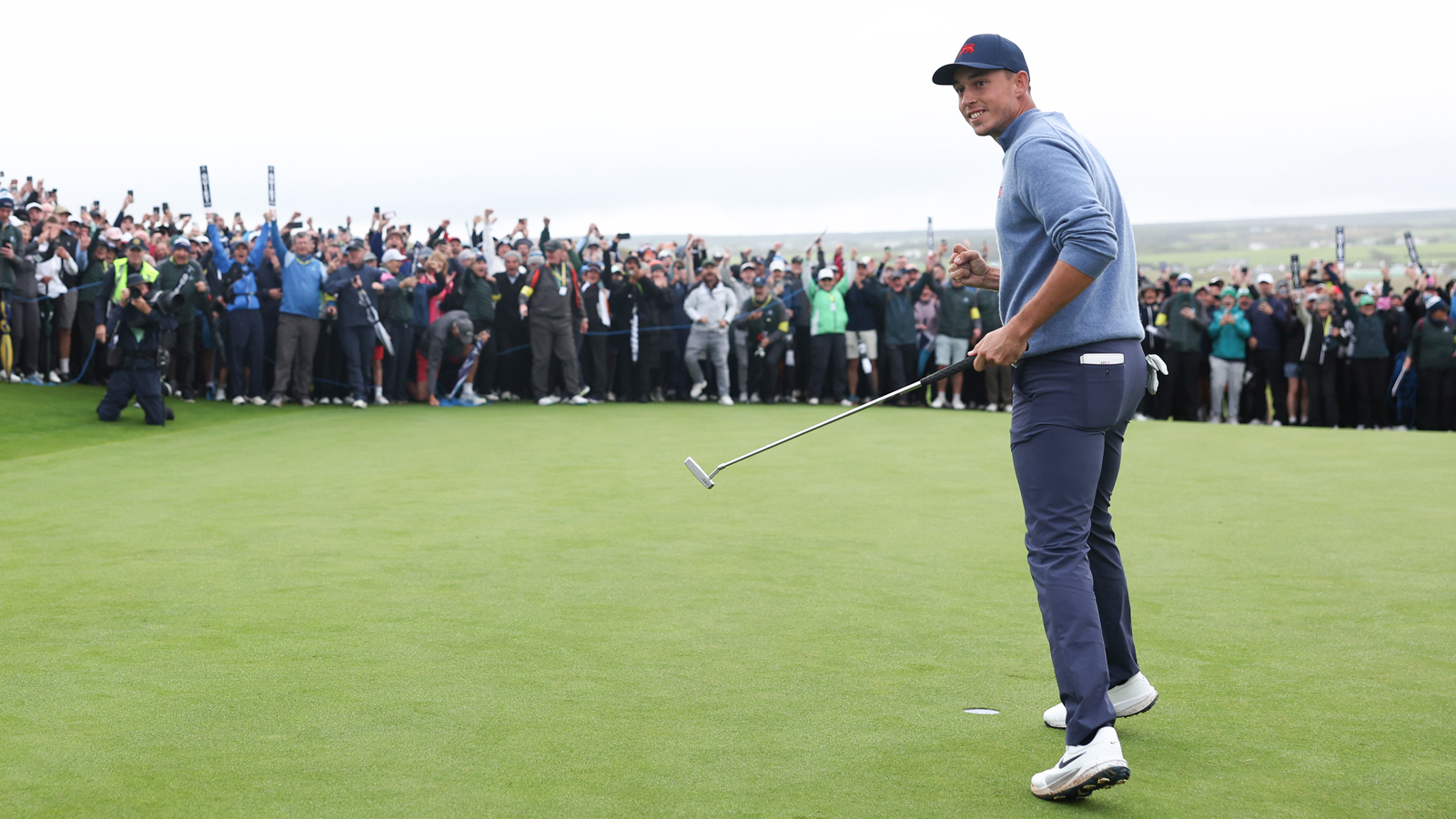 Josh Hill celebrates after holing a winning putt
