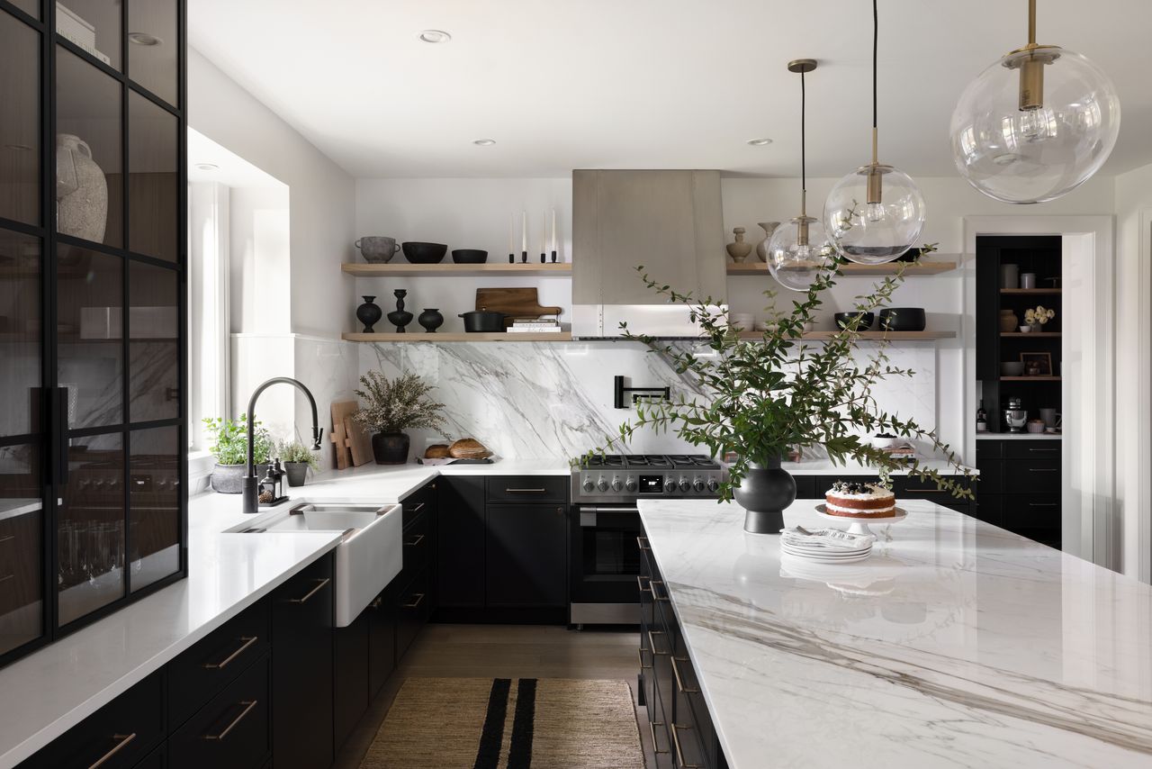 A kitchen with white light globes