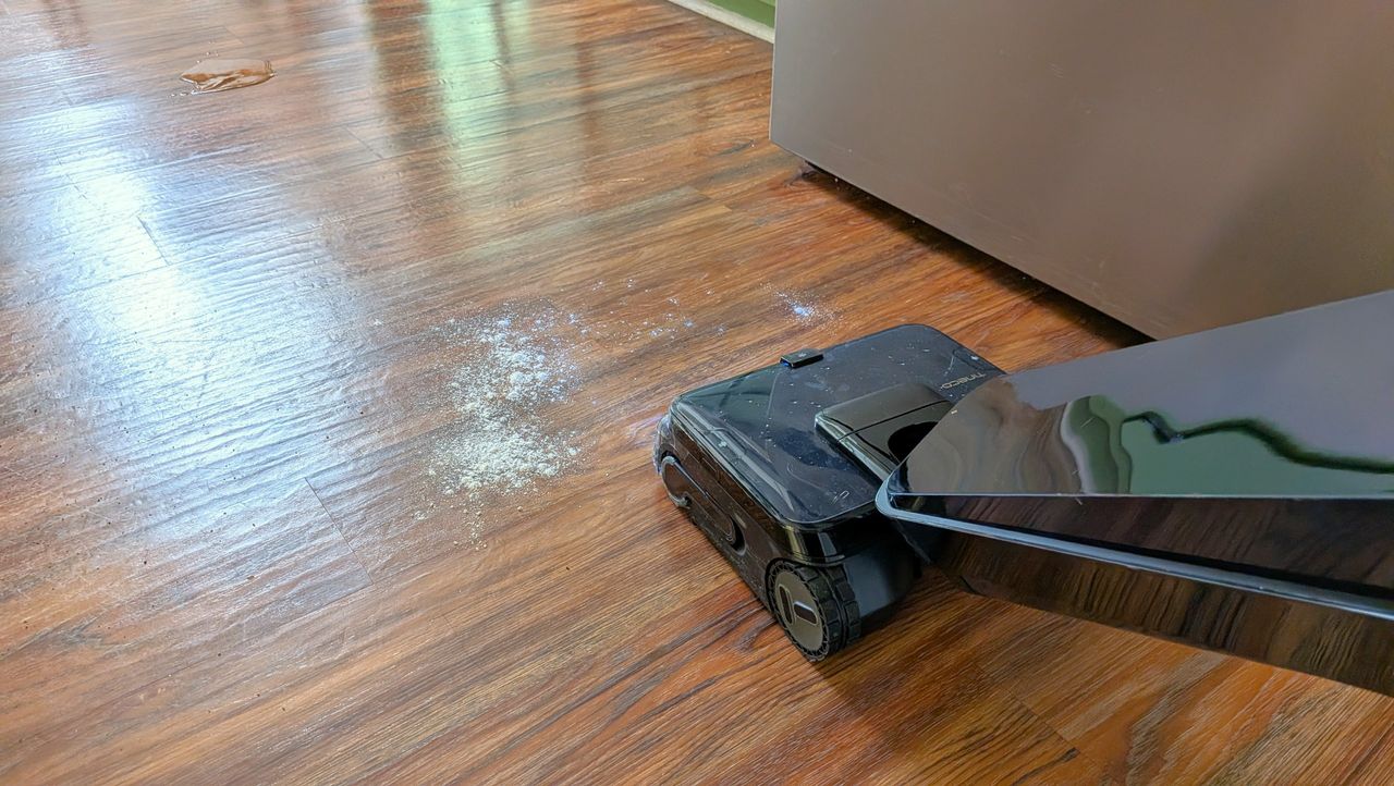 Tineco Floor ONE Station S9 Scientist Pro wet and dry vacuum cleaner vacuuming up dry dirt