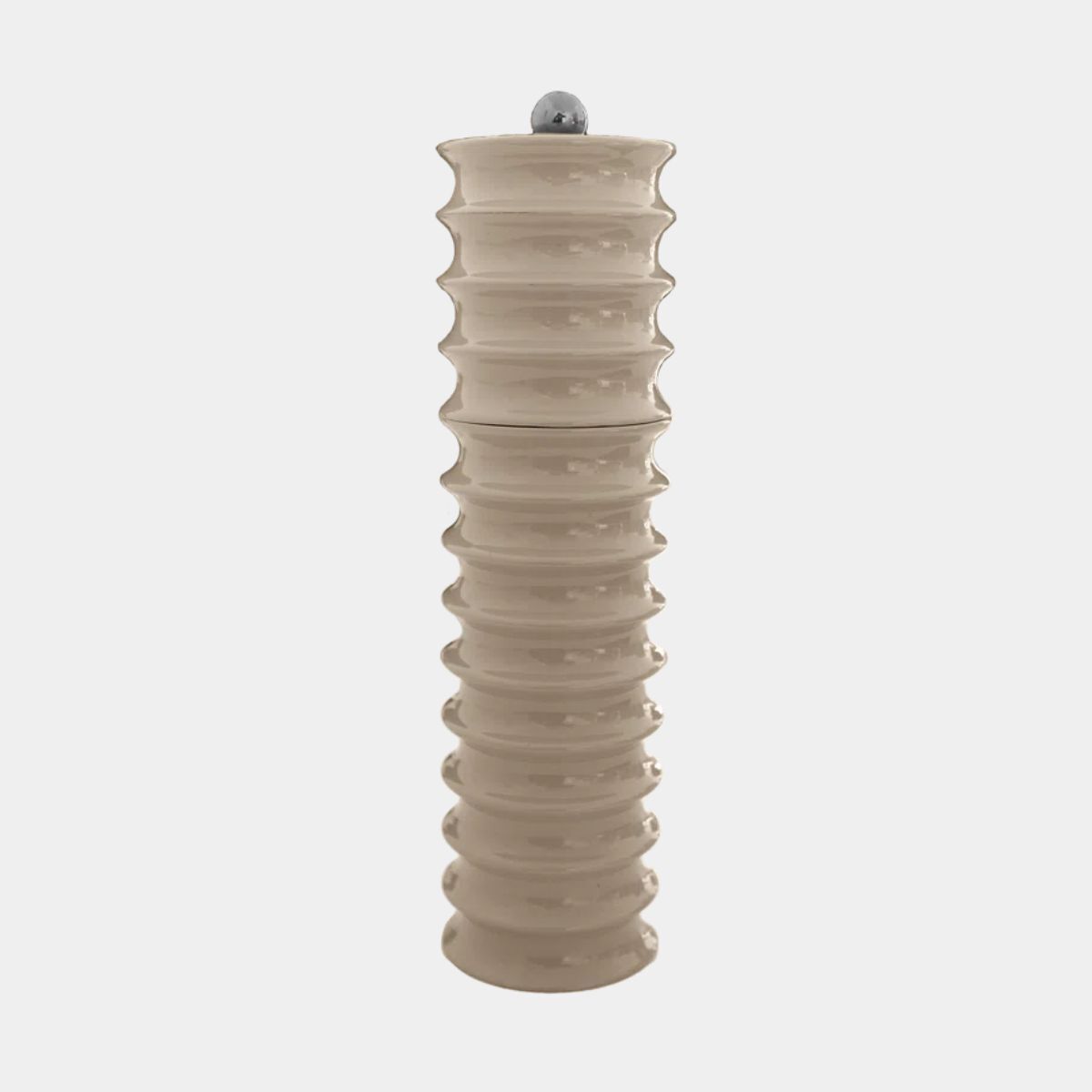 A putty colored salt and pepper grinder