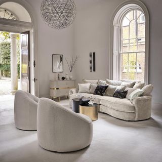 Sofology next chairs in light grey carpeted living room