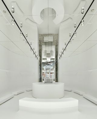 White room with mirrored ceiling