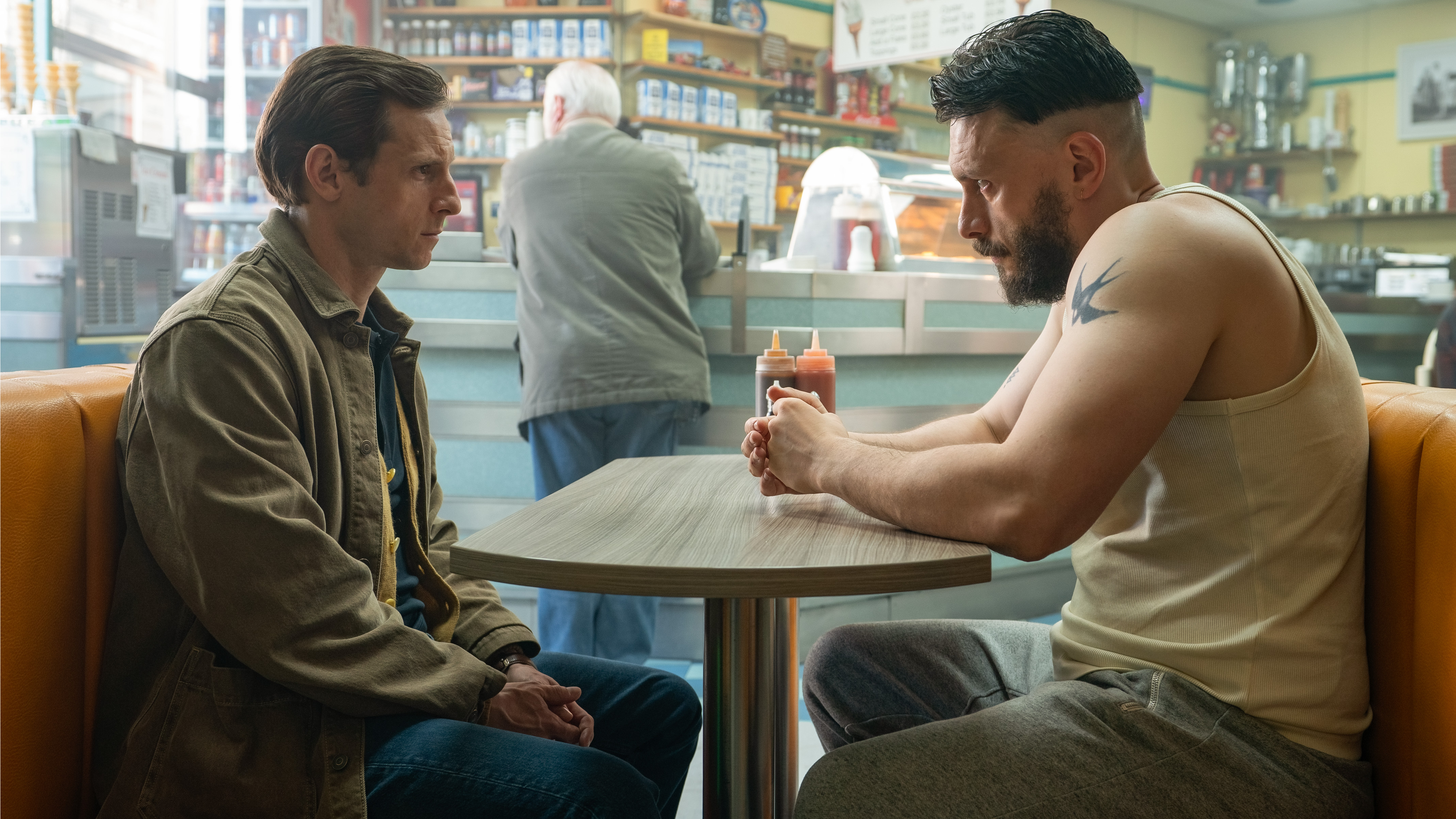 L-R: Niall (Jamie Bell) and Ruben (Richard Gadd) sit across from one another in a diner booth in a scene from &quot;Half Man&quot;