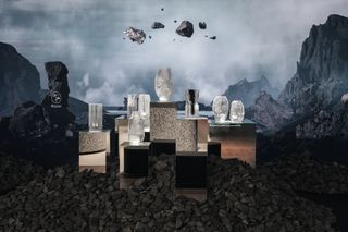 vases on plinths with mountain backdrop