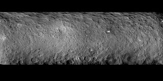 Ceres is covered with many craters, as seen in this mosaic comprised of images taken by NASA's Dawn spacecraft on Feb. 19, 2015 from a distance of nearly 29,000 miles (46,000 kilometers). One Ceres crater houses two mysterious bright spots, which scientists plan to investigate further.