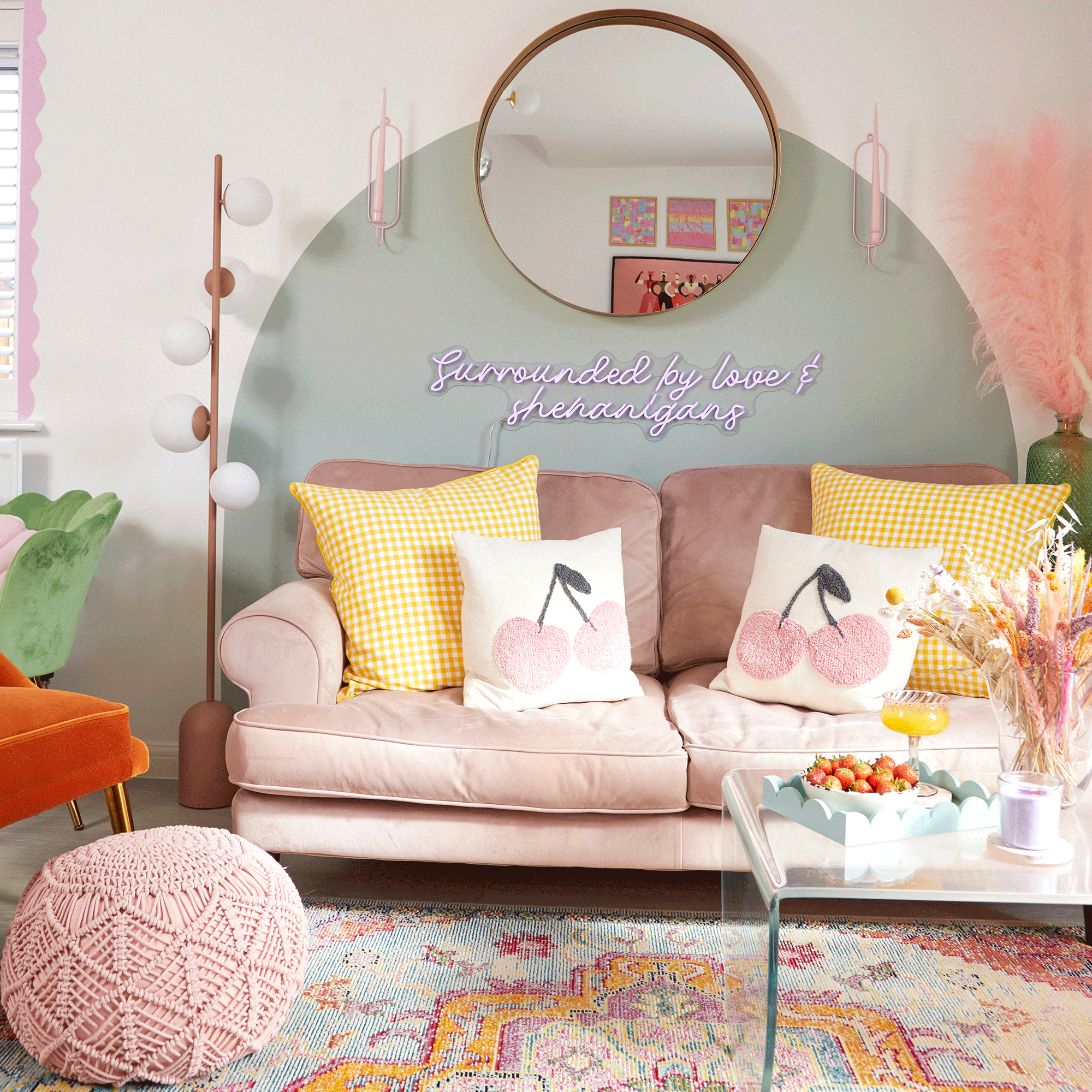 Living room with blue paint circle and pink sofa