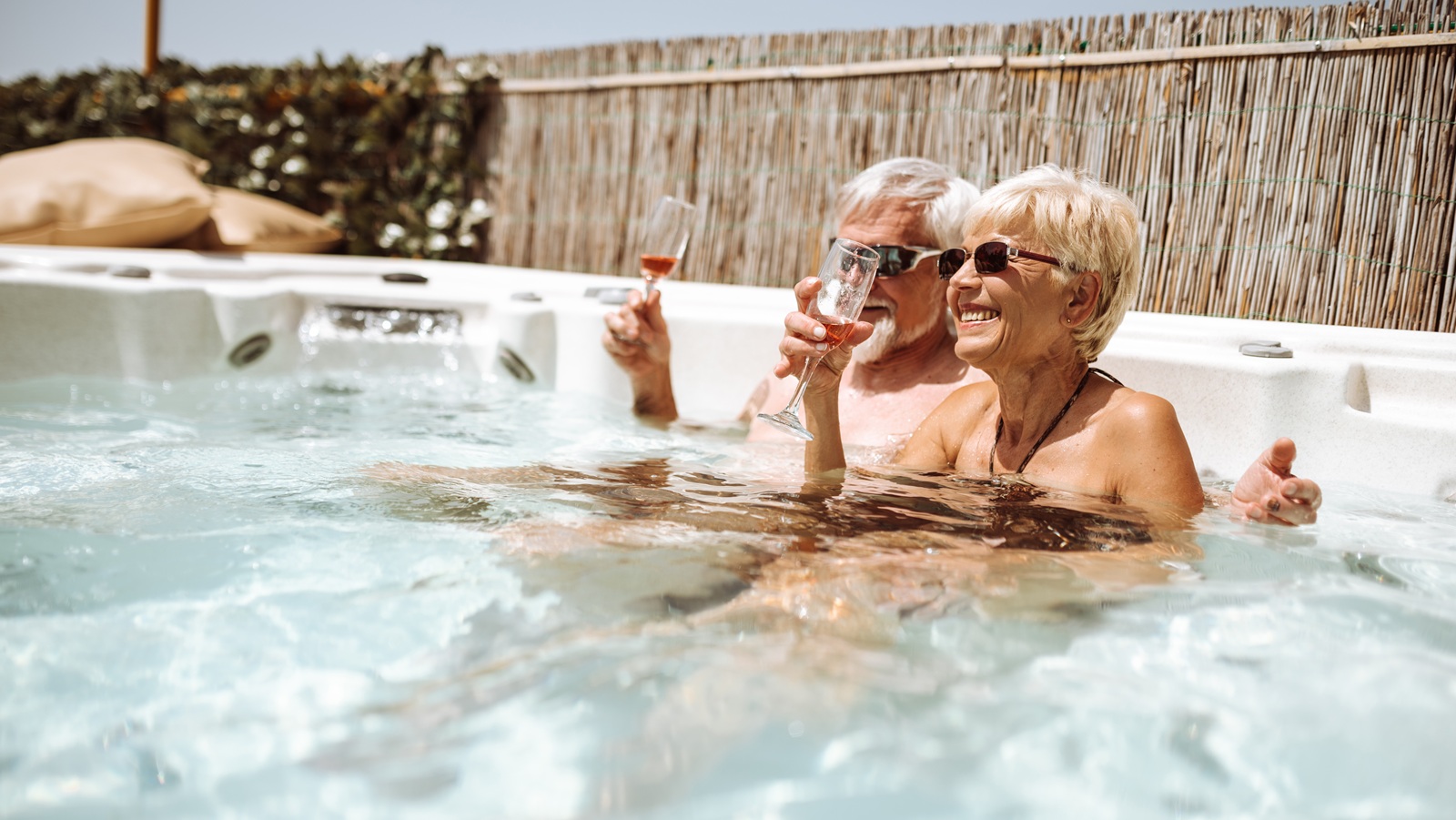 A senior couple relaxing in a hot tub.