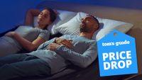 A couple sleeping on a mattress fitted with the Eight Sleep pod 4 Ultra smart cooling mattress cover and smart adjustable base