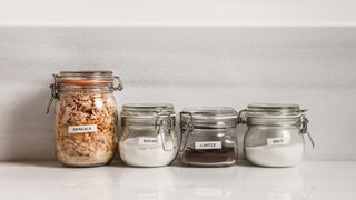 jars full of food items on kitchen countertops labelled