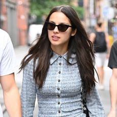 Olivia Rodrigo wearing a plaid mini dress in Manchester