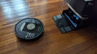 The Shark PowerDetect Robot Vacuum and Mop leaving its charging station