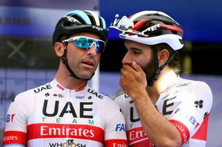 Argentinian road race champion Max Richeze receives a word in his ear from UAE Team Emirates teammate Fernando Gaviria ahead of stage 4 of the 2020 Vuelta a San Juan