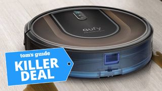 A photo of the eufy robovac g30 hybrid cleaning coffee off a hardwood floor