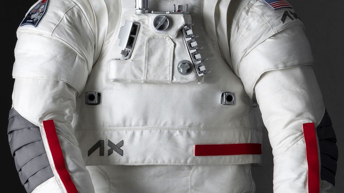 closeup of the torso of a white spacesuit with red and gray highlights