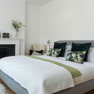 bedroom with double bed and white wall