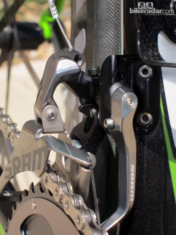 The pivots on the new SRAM Red front derailleur aren't parallel. This allows the cage to self-adjust for angle throughout the range of travel, eliminates chain rub, and does away with the need for front trim positions.