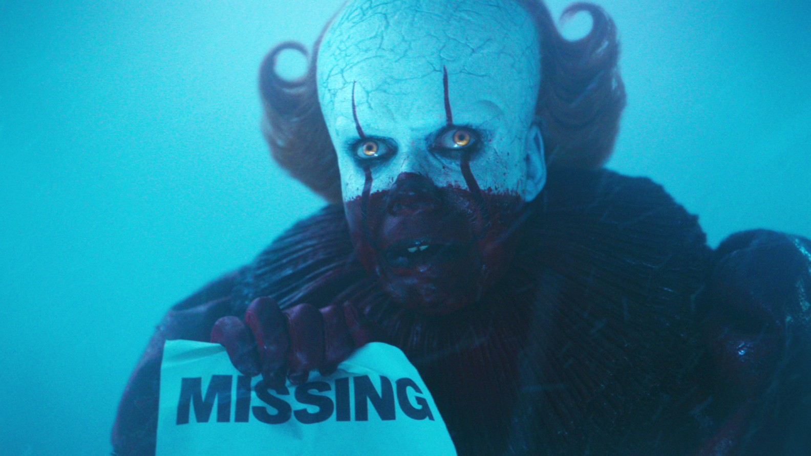 It clown holding a wanted poster