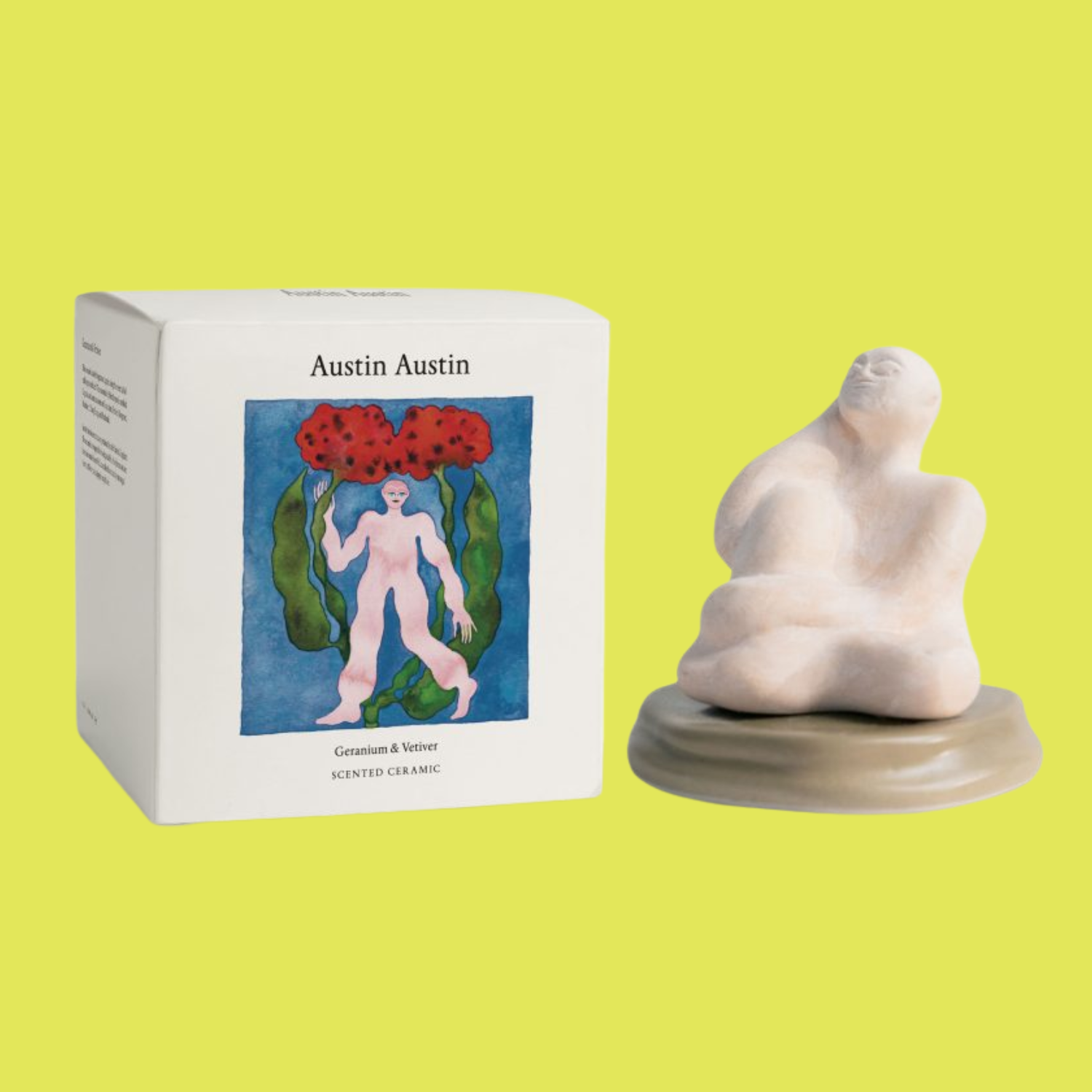 A ceramic statue diffuser by a box