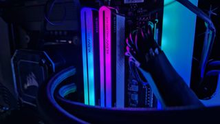Klevv Cras XR5 RGB DDR5 RAM with blue and pink RGB lighting while installed in a gaming PC