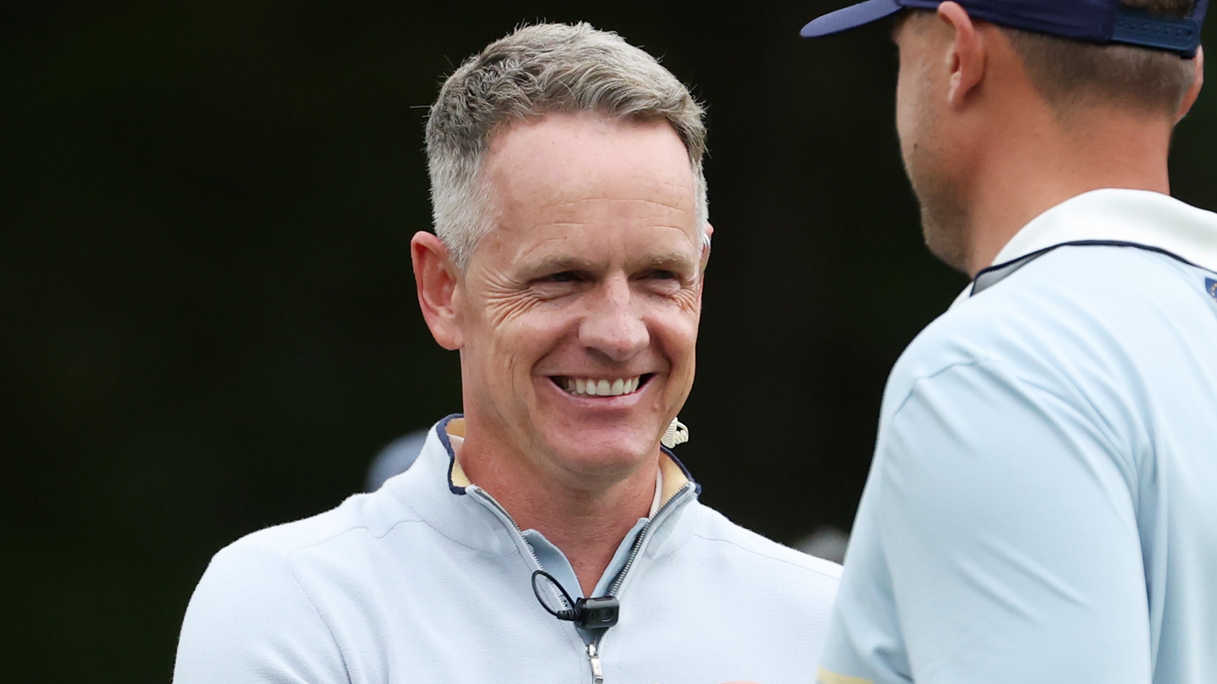 Luke Donald, Captain of Team Europe shakes hands with Ludvig Aberg of Team Europe on the seventh green during the Friday morning foursomes matches of the 2025 Ryder Cup at Black Course at Bethpage State Park Golf Course on September 26, 2025 in Farmingdale, New York.
