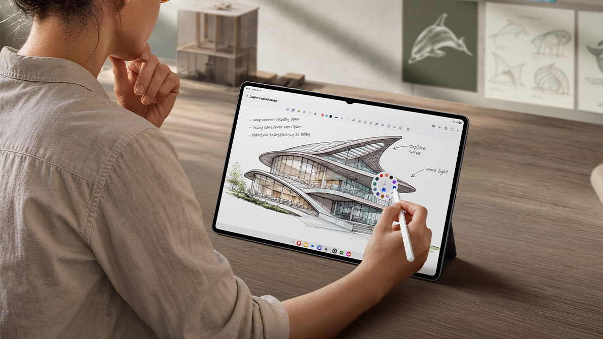 A woman using a Samsung Galaxy Tab S12 Ultra with an S Pen