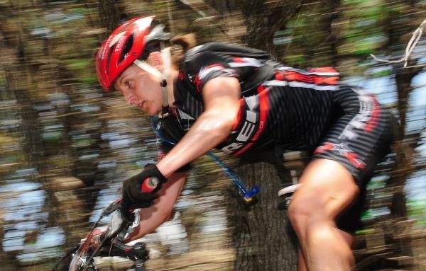 A Trek rider descends through the trees