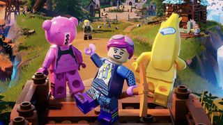 Three Lego Fortnite characters stand looking out over its vast open world. The one in the centre waves at the camera
